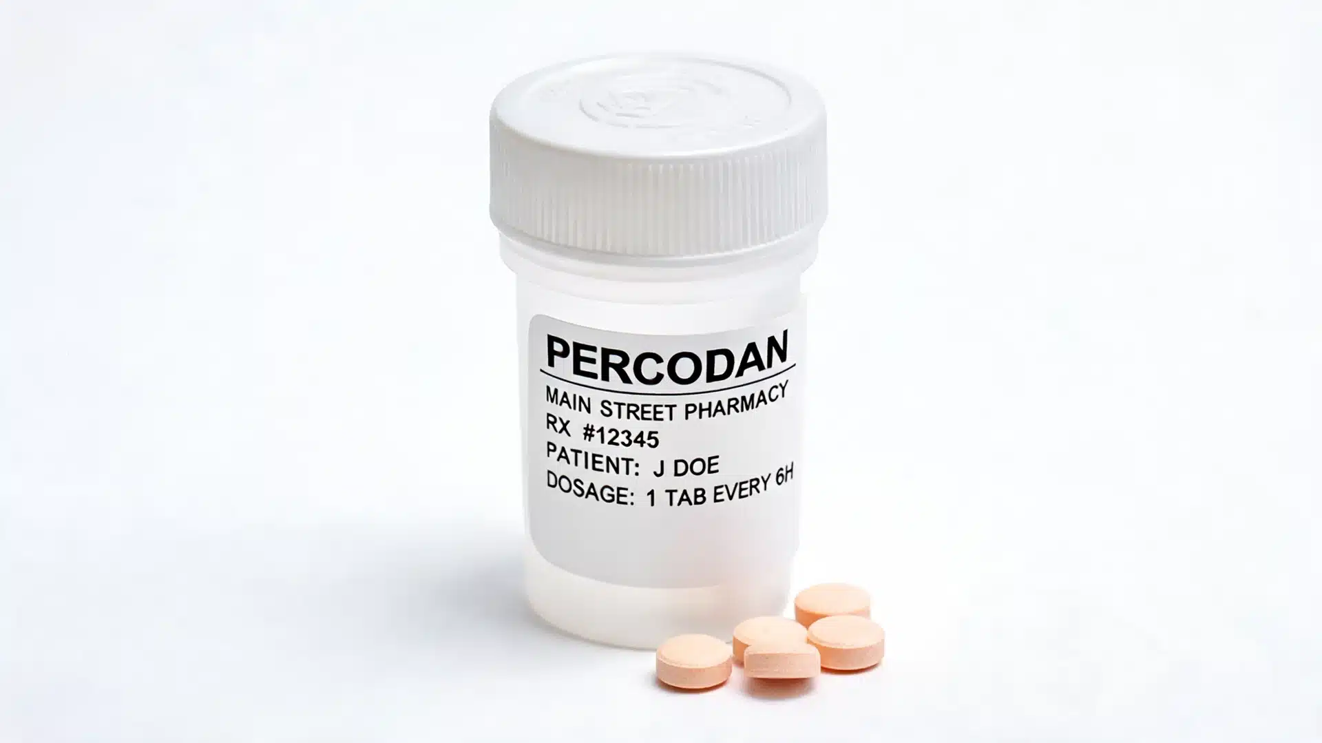 a prescription bottle labeled percodan with four orange pills placed next to it on a plain white background