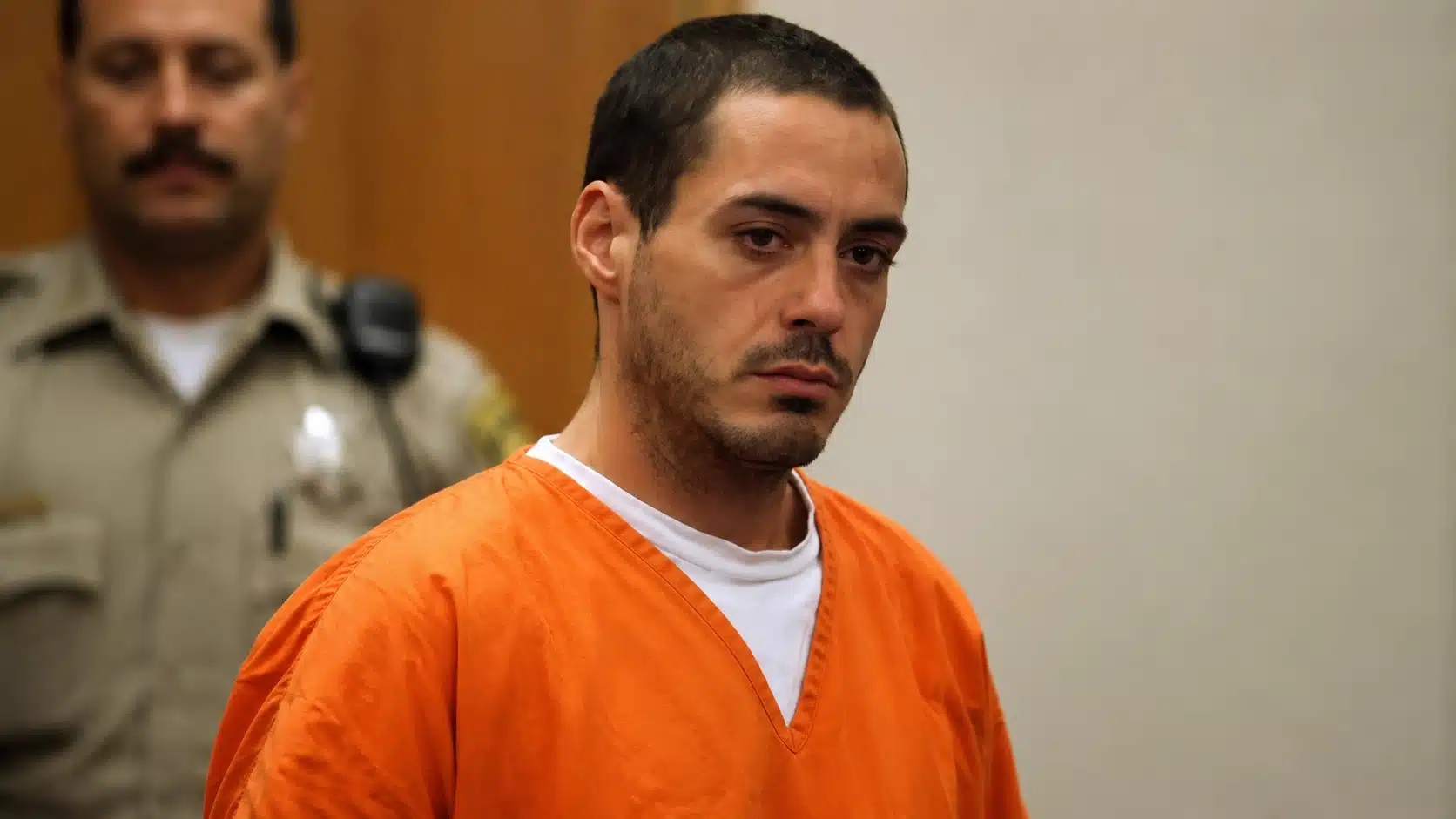 robert downey jr addiction leading to his arrest showing him in a courtroom in orange jumpsuit, legal struggles