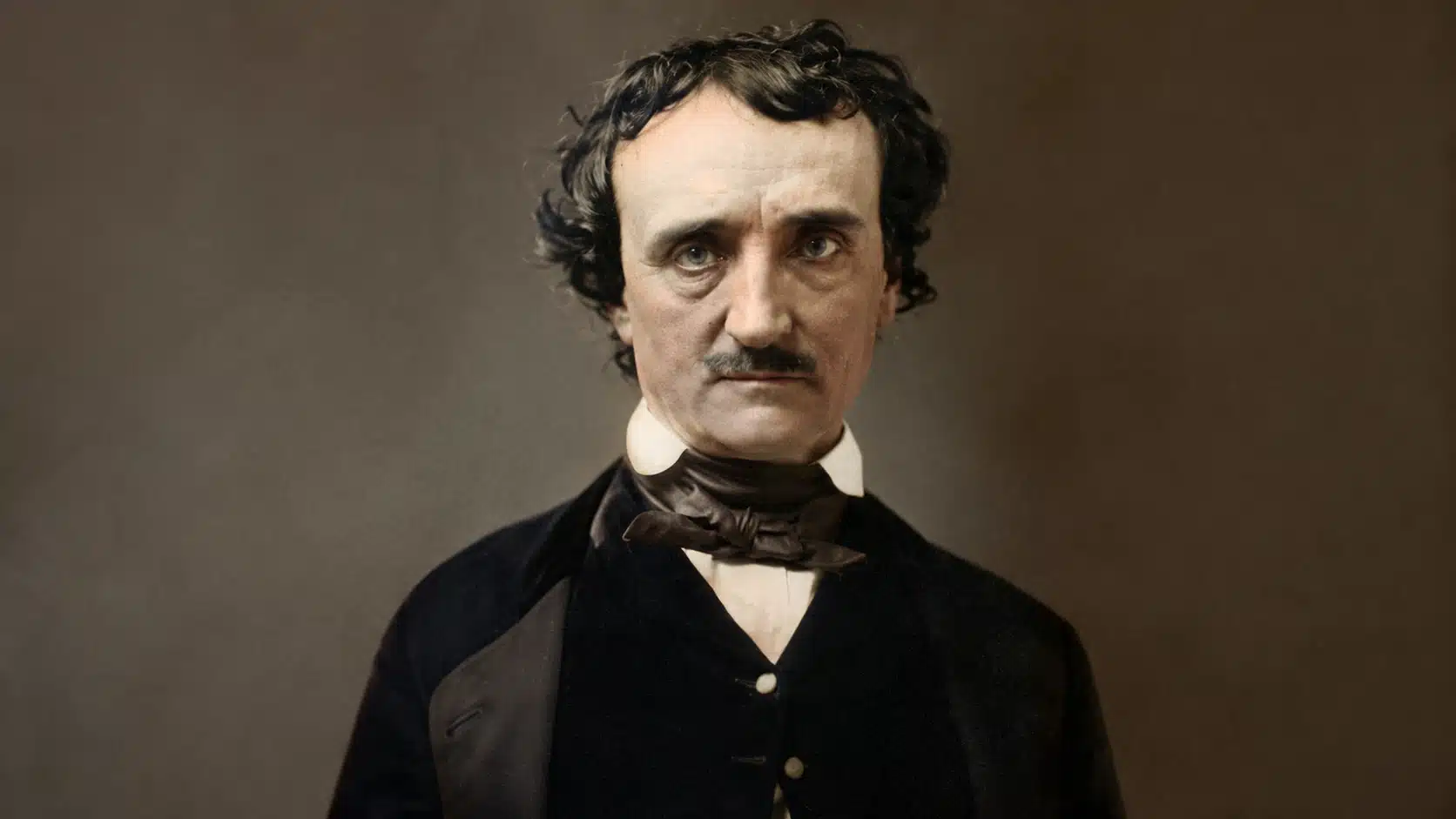 colorized vintage portrait of a serious man in victorian clothing, facing camera against a plain dark studio background