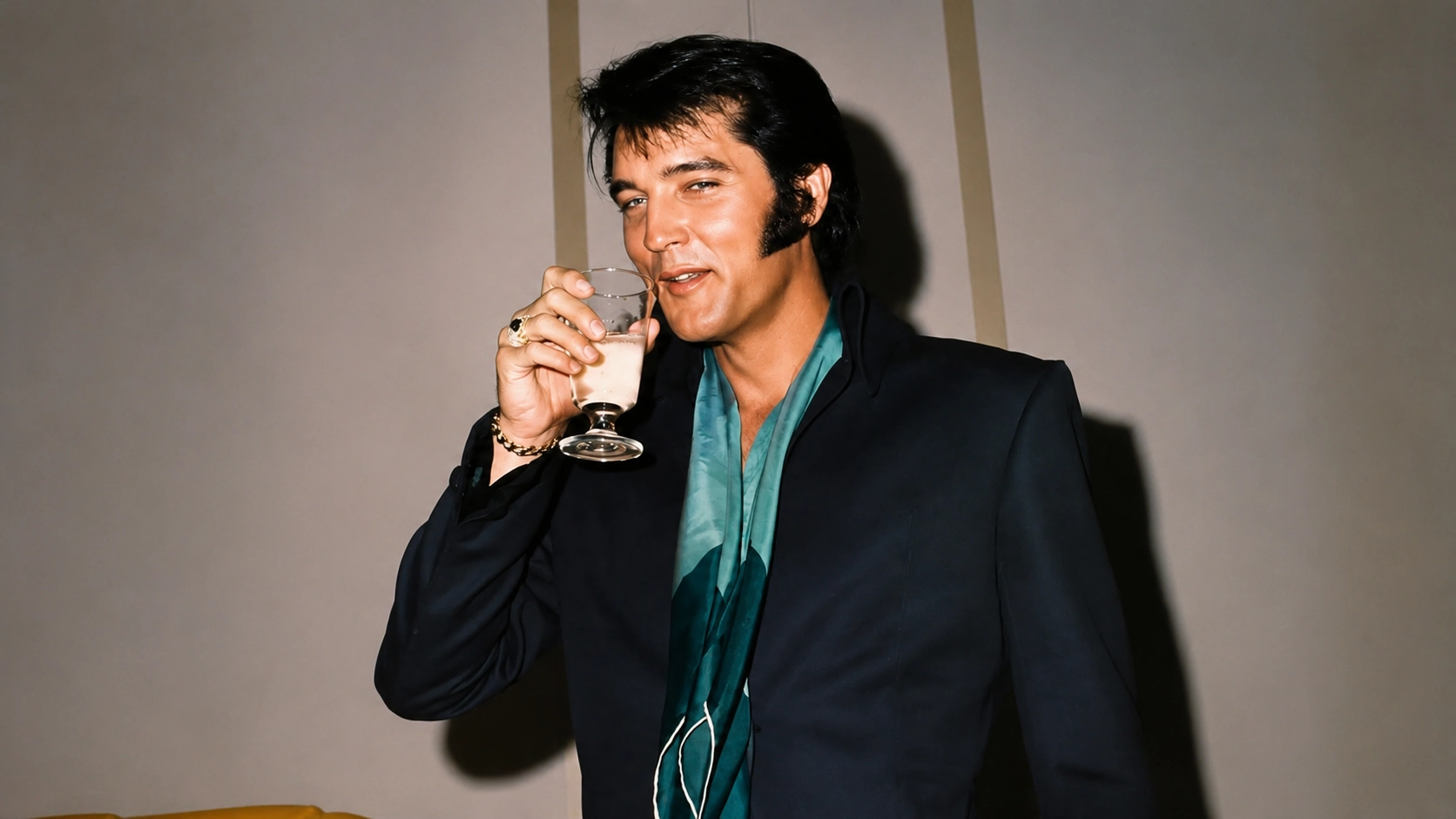 elvis presley raising a glass in a colored 1970s portrait, illustrating the context of what drugs did elvis do